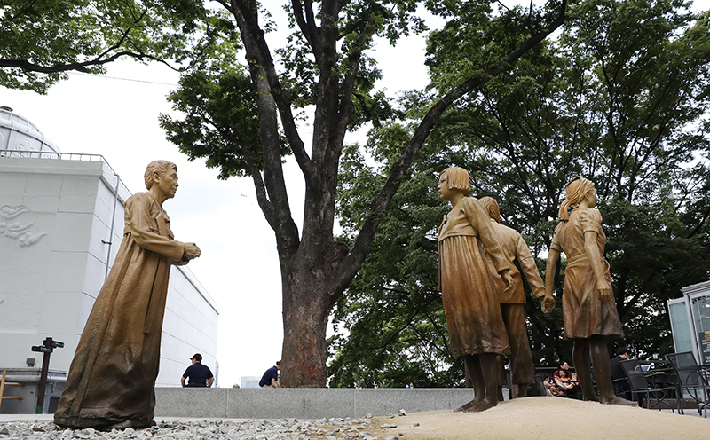 Three statues commemorating comfort women on Aug. 14 are placed near Joseon Shingung in Seoul's Jung-gu District, a historical venue from the era of Japanese colonial rule of the Korean Peninsula in the early 20th century.